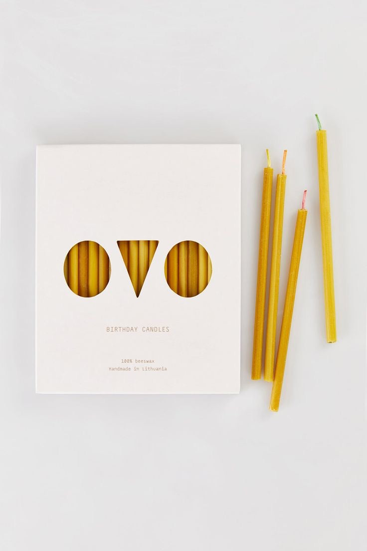 Pure beeswax birthday candles with multicolored cotton wicks.